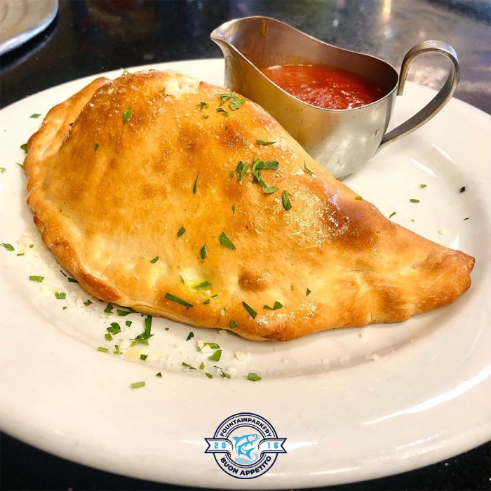  Loaded Calzones Served on a Plate with Sauce at Fountain Park Fry Edinburgh 